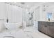 Beautiful primary bathroom showcasing a freestanding tub, glass shower and marble flooring at 201 Dobbs Rd, Woodstock, GA 30188