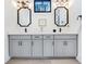 Elegant bathroom featuring a double vanity, quartz countertops, and modern fixtures at 201 Dobbs Rd, Woodstock, GA 30188