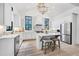 Elegant kitchen with white cabinets, stainless steel appliances, and a center island at 201 Dobbs Rd, Woodstock, GA 30188