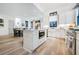 Open concept kitchen showcases a central island with seating, stainless steel appliances and farmhouse sink at 201 Dobbs Rd, Woodstock, GA 30188