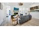 Spacious living room has a modern fireplace with a TV, plush seating, and shiplap walls at 201 Dobbs Rd, Woodstock, GA 30188