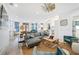 Bright living room featuring a ceiling fan, modern decor, and an open floor plan at 201 Dobbs Rd, Woodstock, GA 30188