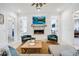 Stylish living room features a fireplace, flat screen tv, comfortable seating, and modern decor at 201 Dobbs Rd, Woodstock, GA 30188