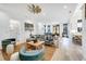 Open layout shows the living room flowing into the dining and kitchen area for a seamless living experience at 201 Dobbs Rd, Woodstock, GA 30188