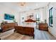 Elegant main bedroom with a hardwood floor, luxury bed, and backyard views at 201 Dobbs Rd, Woodstock, GA 30188