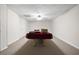 Spacious basement with carpet, ceiling fan, and neutral paint at 5034 Kingsbridge Pass, Powder Springs, GA 30127