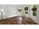 Inviting room boasting hardwood floors, natural light from large windows, and calming neutral paint at 5034 Kingsbridge Pass, Powder Springs, GA 30127