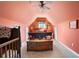 Attic bedroom featuring an antique dresser, sloped walls, and decorative accents at 5034 Kingsbridge Pass, Powder Springs, GA 30127
