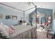 Bright bedroom with a four poster bed, vaulted ceilings, and plenty of natural light at 5034 Kingsbridge Pass, Powder Springs, GA 30127
