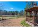 Scenic gazebo overlooking a tranquil lake with a fountain, creating a serene community space at 5034 Kingsbridge Pass, Powder Springs, GA 30127