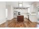 Modern kitchen with stainless steel appliances and an island with a cooktop at 5034 Kingsbridge Pass, Powder Springs, GA 30127