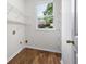 Pantry has wire shelving with natural light and hardwood floors at 5034 Kingsbridge Pass, Powder Springs, GA 30127
