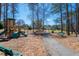 Community playground featuring modern play equipment, walking paths, and park benches at 5034 Kingsbridge Pass, Powder Springs, GA 30127