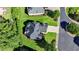 An aerial view displays the roofline and surrounding landscaping of this luxury estate home at 8340 Royal Melbourne Way, Duluth, GA 30097