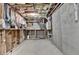 Unfinished basement with exposed ceiling, concrete floor and walls and utilities at 8340 Royal Melbourne Way, Duluth, GA 30097