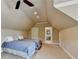 Upstairs bonus room with a sloped ceiling and two twin beds at 8340 Royal Melbourne Way, Duluth, GA 30097