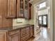 Grand entryway showcasing a staircase and custom cabinetry with granite countertops at 8340 Royal Melbourne Way, Duluth, GA 30097