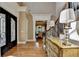 Grand foyer featuring hardwood floors, a staircase with wrought iron detailing, and an elegant double door entrance at 8340 Royal Melbourne Way, Duluth, GA 30097