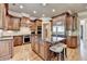 Spacious kitchen with custom cabinets, stainless steel appliances and a large granite island with seating at 8340 Royal Melbourne Way, Duluth, GA 30097