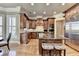Well-appointed kitchen featuring custom cabinetry, granite countertops, and modern stainless steel appliances at 8340 Royal Melbourne Way, Duluth, GA 30097