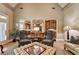 Open concept living room with a patterned rug and direct view into kitchen area at 8340 Royal Melbourne Way, Duluth, GA 30097
