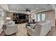 Bright living room features built-in shelves and French doors leading to the yard at 8340 Royal Melbourne Way, Duluth, GA 30097