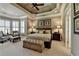 Luxurious main bedroom with vaulted ceilings, custom windows, and comfortable seating area at 8340 Royal Melbourne Way, Duluth, GA 30097
