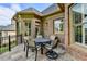 An outdoor patio seating area features brick walls and tiled floors perfect for entertaining and relaxing at 8340 Royal Melbourne Way, Duluth, GA 30097