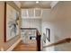This staircase leads upstairs with hardwood flooring and trim at 8340 Royal Melbourne Way, Duluth, GA 30097