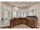 Wet bar features granite countertops and an undermounted stainless steel sink at 8340 Royal Melbourne Way, Duluth, GA 30097