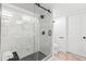 Contemporary bathroom with a glass-enclosed shower and neutral-toned tile at 199 14Th Ne St # 2312, Atlanta, GA 30309