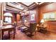 Cozy wood-paneled library featuring coffered ceilings, comfortable seating, and built-in bookshelves for residents to enjoy at 199 14Th Ne St # 2312, Atlanta, GA 30309