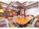 Elegant reading room featuring wood trim, coffered ceilings, built-in bookshelves, and a large table with seating at 199 14Th Ne St # 2312, Atlanta, GA 30309