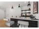 Stylish bar with modern pendant lighting, white countertops, and geometric backsplash at 2385 Nesbitt Dr, Brookhaven, GA 30319