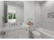 Cozy bathroom featuring a vanity with marble countertop, white tiled shower and a soaking bathtub at 2385 Nesbitt Dr, Brookhaven, GA 30319