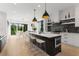 Eat-in kitchen with a spacious island, stylish stools, and stainless-steel appliances for modern convenience at 2385 Nesbitt Dr, Brookhaven, GA 30319