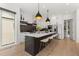 Modern kitchen featuring stainless steel appliances, a large island, ample storage, and barstool seating at 2385 Nesbitt Dr, Brookhaven, GA 30319