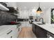 Modern kitchen featuring white cabinets, stainless steel appliances, a large island, and stylish backsplash at 2385 Nesbitt Dr, Brookhaven, GA 30319
