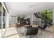 Open concept living room with lots of natural light and an open staircase at 2385 Nesbitt Dr, Brookhaven, GA 30319
