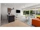 Open concept living space with modern fixtures and a view to a patio and backyard at 2385 Nesbitt Dr, Brookhaven, GA 30319
