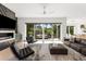 Bright living room featuring large windows, modern furniture, and access to the outdoor space at 2385 Nesbitt Dr, Brookhaven, GA 30319