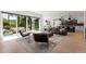 Spacious living room with floor to ceiling sliding glass doors and access to a patio at 2385 Nesbitt Dr, Brookhaven, GA 30319