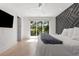 Main bedroom with stylish accent wall and a private outdoor balcony at 2385 Nesbitt Dr, Brookhaven, GA 30319