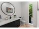 Modern powder room with stylish vanity, fixtures, mirror and decor with outdoor views at 2385 Nesbitt Dr, Brookhaven, GA 30319