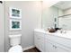 Bright bathroom featuring a double vanity, large mirror, and a clean, modern design at 3062 Cambridge Mill St, Acworth, GA 30102