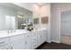 Bathroom with double vanity, and large mirror and is spacious and has modern fixtures at 3062 Cambridge Mill St, Acworth, GA 30102