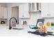 Stylish kitchen featuring stainless steel appliances and white cabinetry with modern accents at 3062 Cambridge Mill St, Acworth, GA 30102