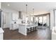 Modern kitchen with white cabinetry, stainless steel appliances, and a breakfast bar at 3062 Cambridge Mill St, Acworth, GA 30102