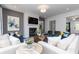 Comfortable living room featuring a fireplace, stylish decor, and neutral colors at 3062 Cambridge Mill St, Acworth, GA 30102