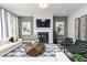 Inviting living room with a fireplace and stylish decor for a cozy and elegant ambiance at 3062 Cambridge Mill St, Acworth, GA 30102